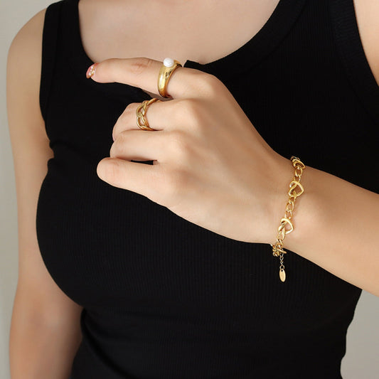 Pulsera de acero de titanio chapado en oro de 18 quilates