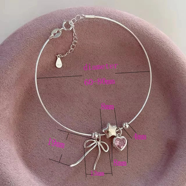 Pulsera y collar con diseño de estrellas, corazones y lazos