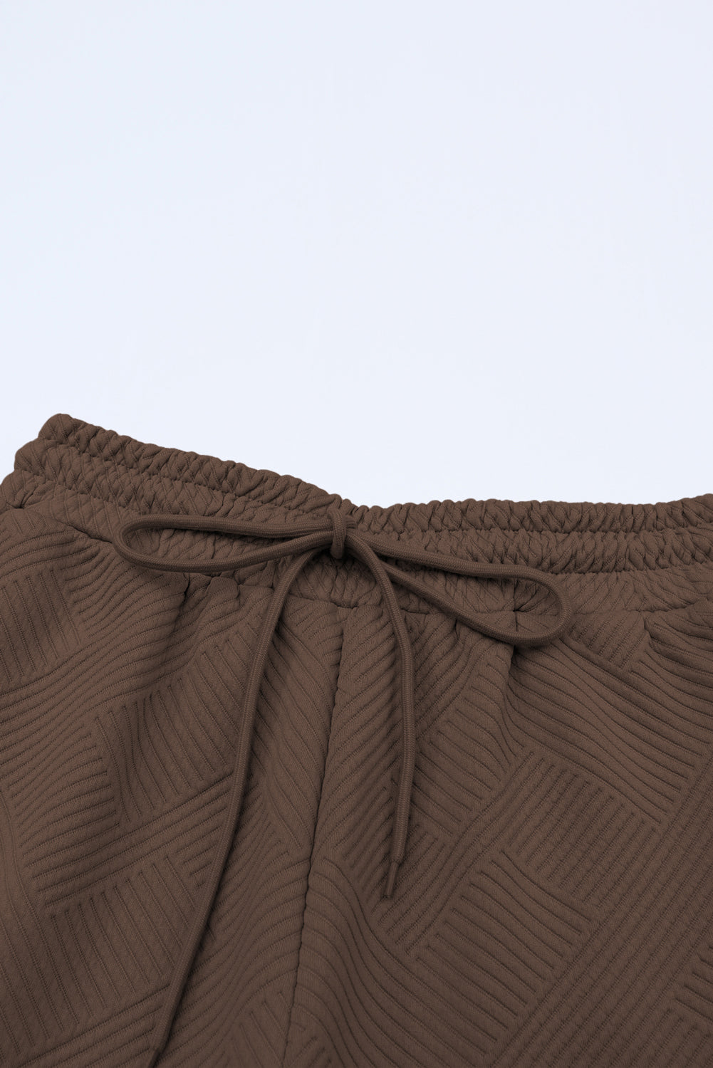 Conjunto de camiseta holgada texturizada y pantalones con cordón ajustables, color café