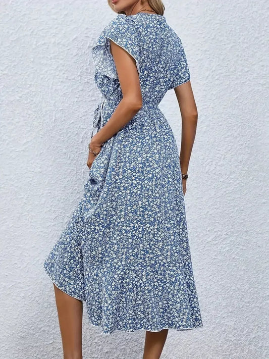 Vestido midi cruzado con estampado floral y bajo con volantes