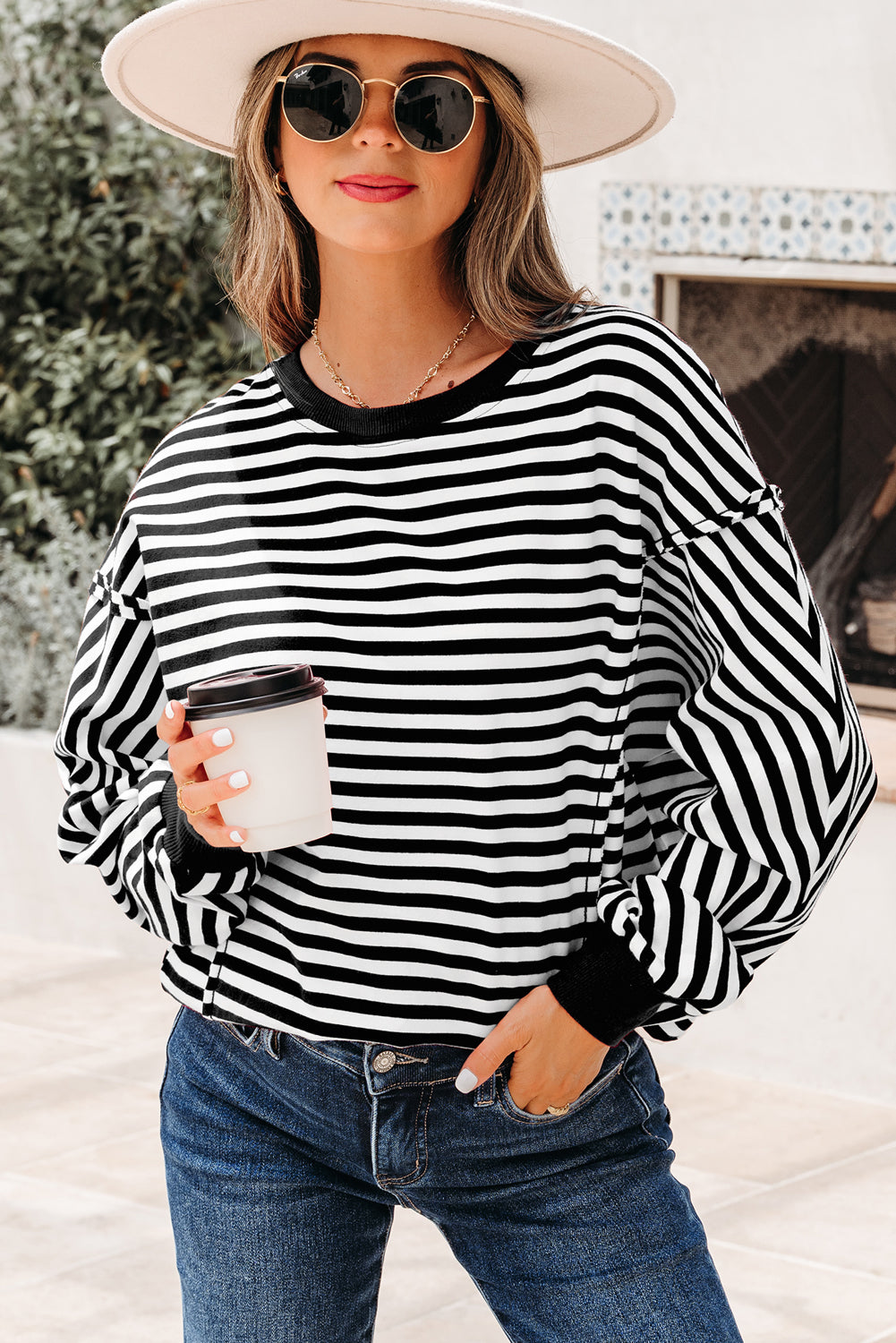Top tipo jersey casual de hombros caídos con costuras expuestas a rayas naranjas