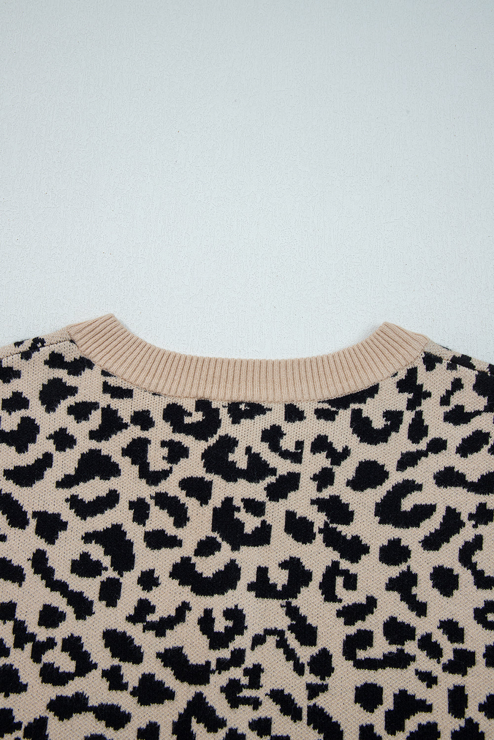 Cárdigan de punto de hombros caídos con estampado de leopardo naranja