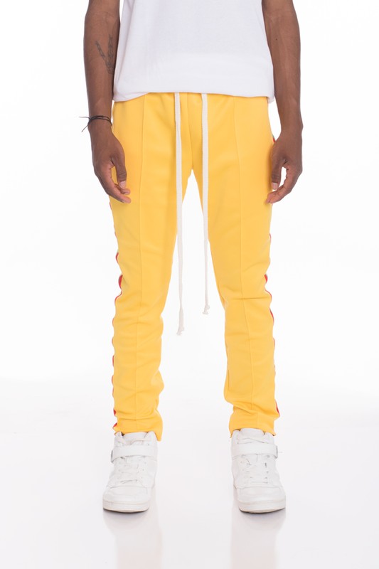PANTALONES DE CHÁNDAL CON RAYAS DE RASTA