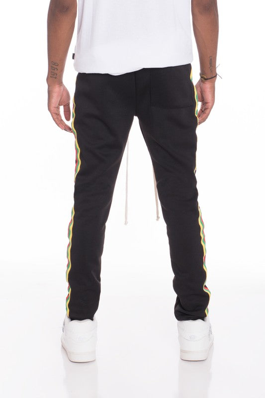 PANTALONES DE CHÁNDAL CON RAYAS DE RASTA
