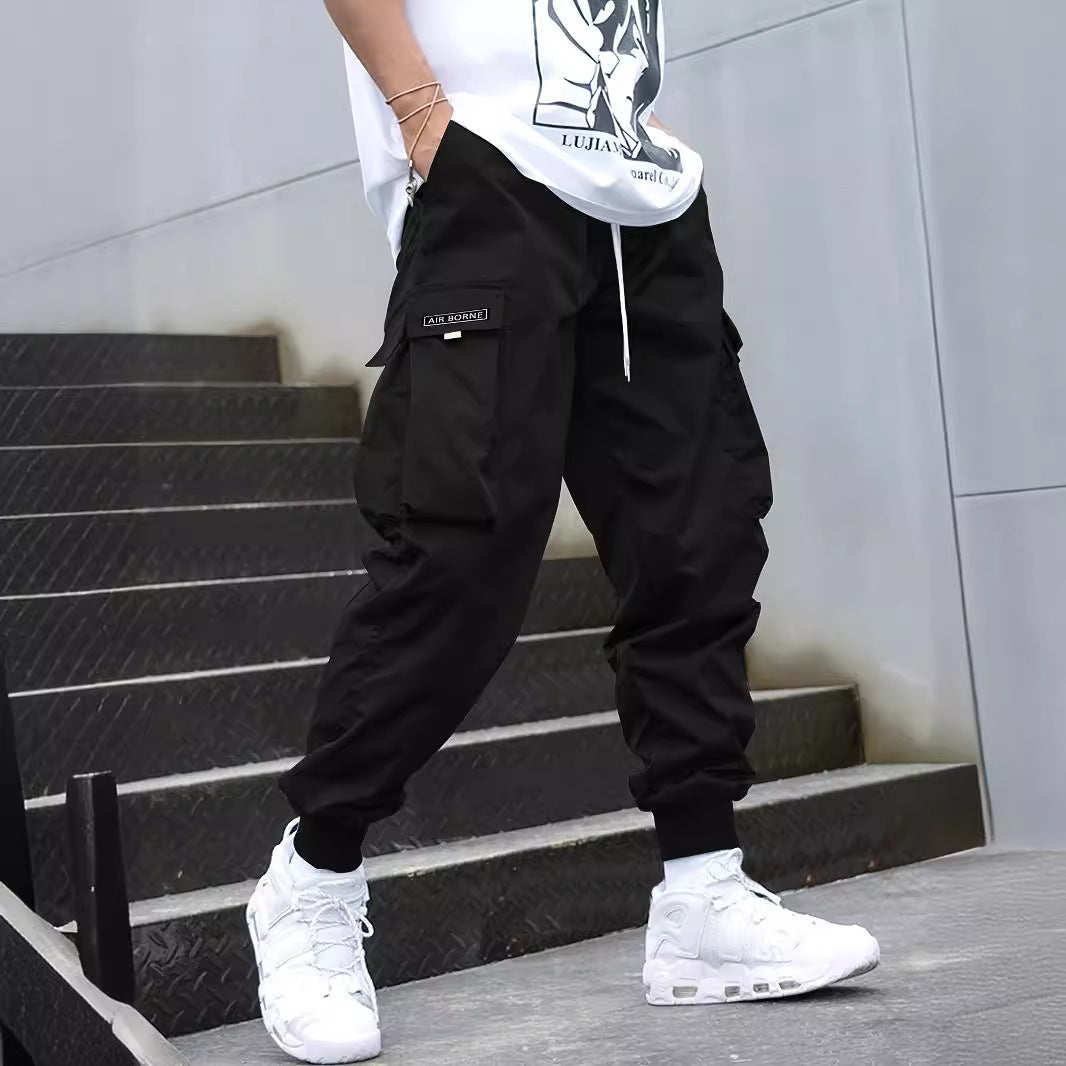 Pantalones cargo de hombre con múltiples bolsillos y cordón