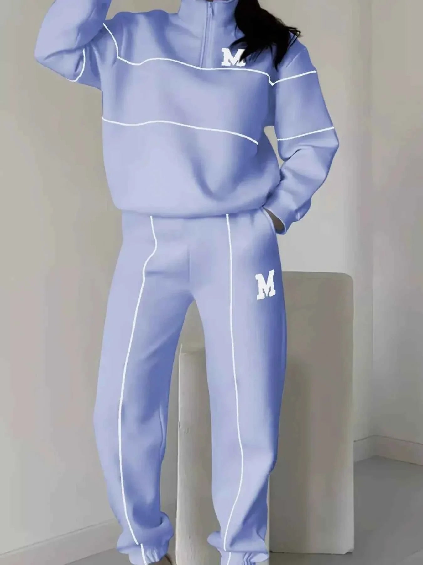 Conjunto de pantalón y top de rayas con cremallera hasta el pecho de talla grande