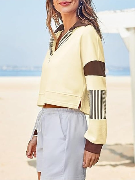 Sudadera corta tipo polo con cuello en V y bloques de color
