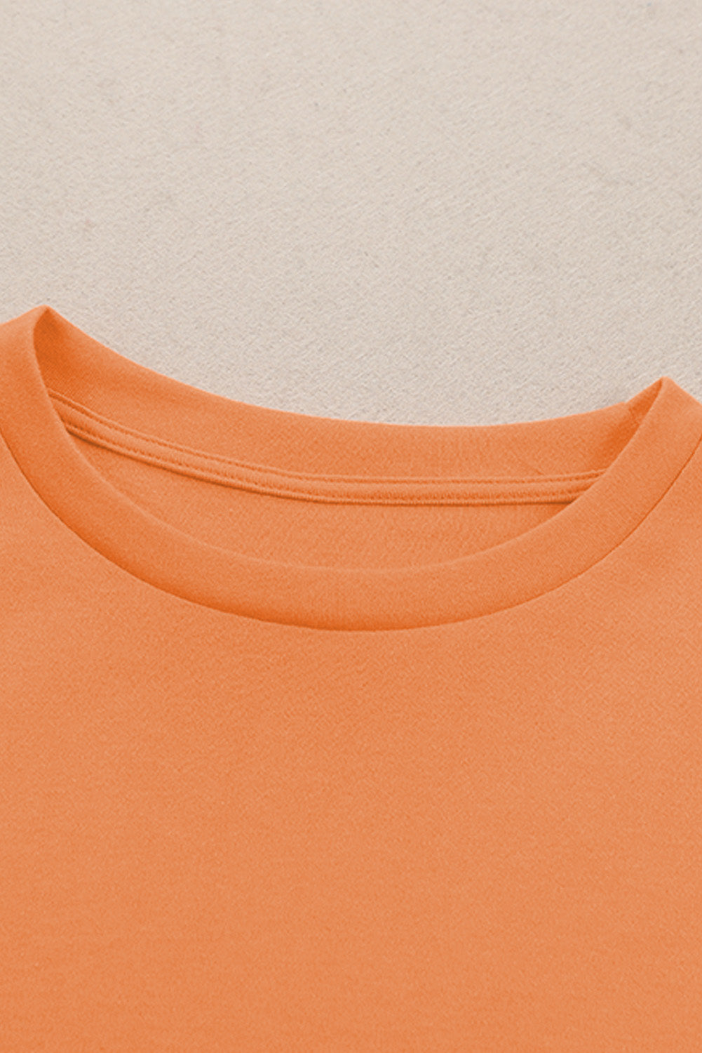 Top naranja liso de manga larga con cuello redondo