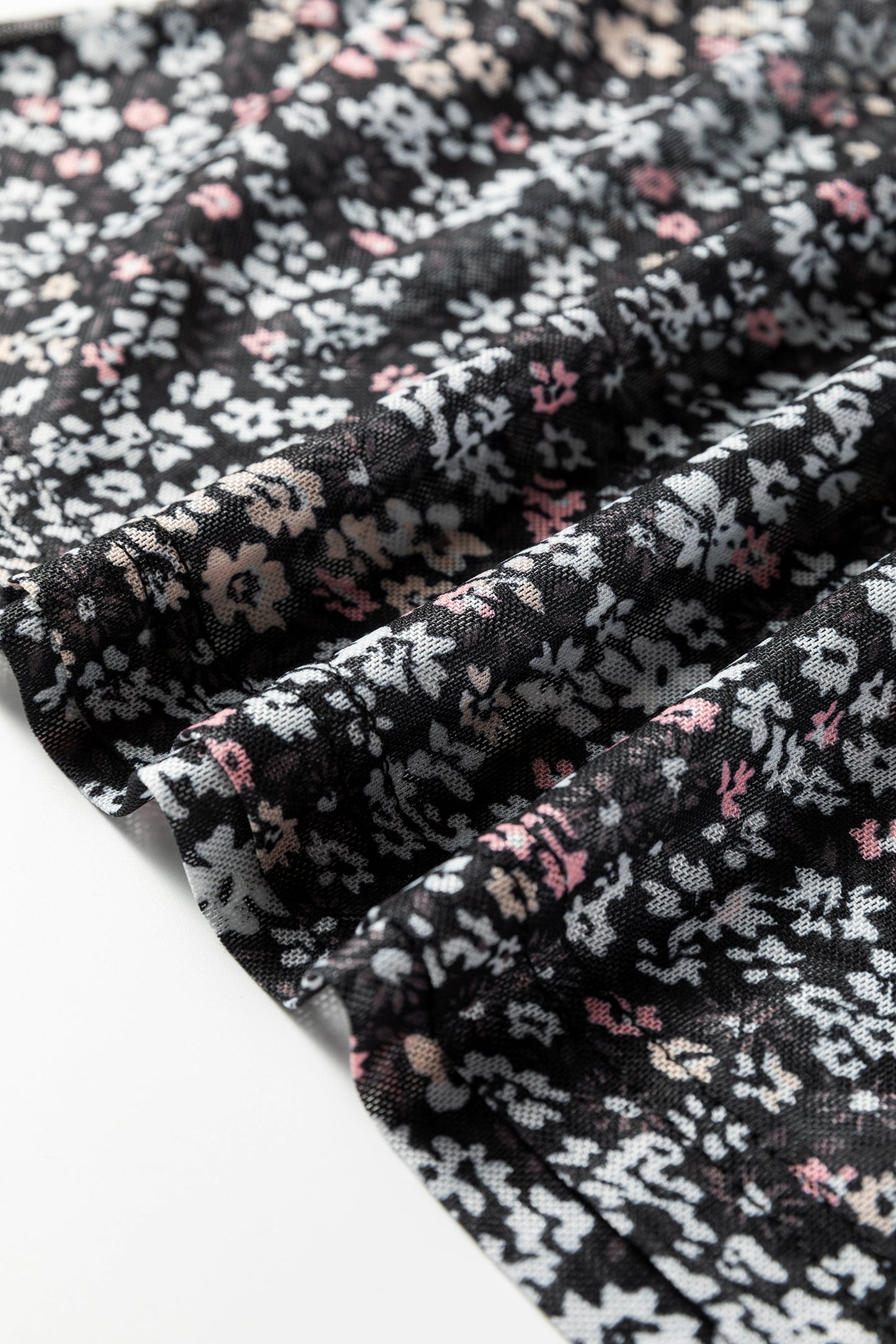 Top ajustado de malla con estampado floral pequeño y orificio para el pulgar