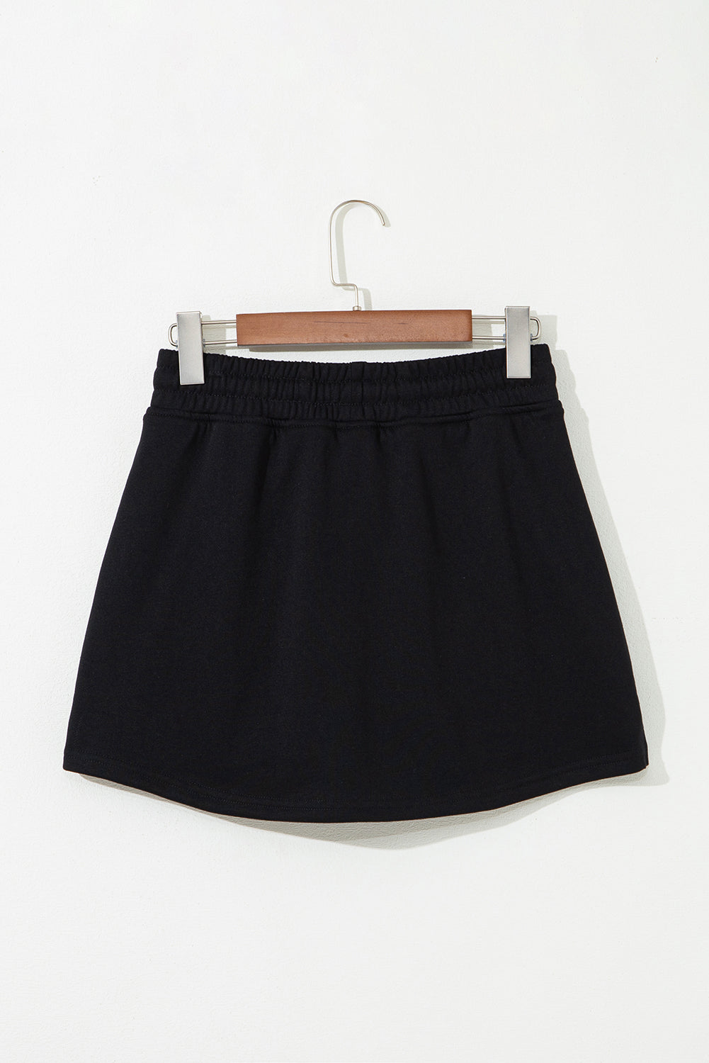Minifalda pantalón de felpa francesa negra con cordón y bolsillos