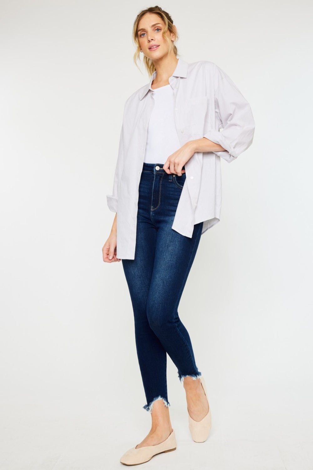 Jeans ajustados Kancan de tiro alto con dobladillo deshilachado hasta el tobillo, talla completa