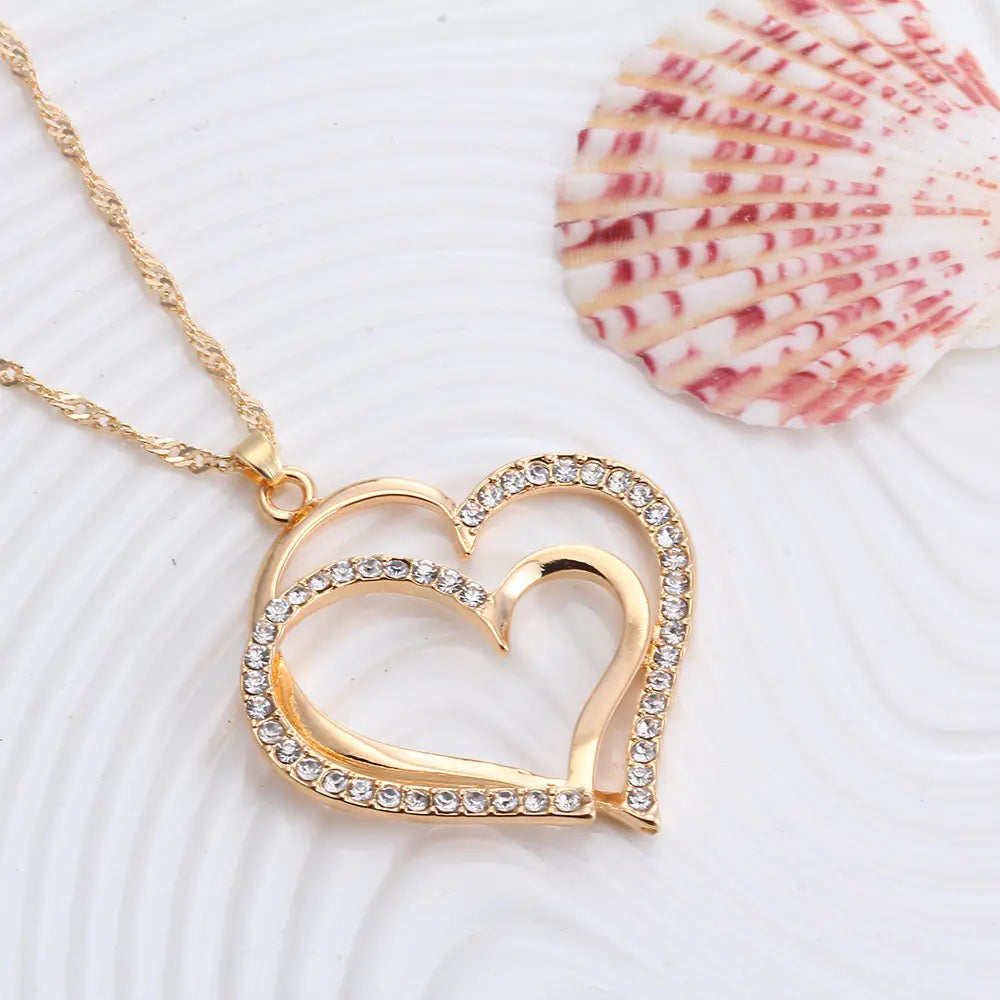 Juego de boda de pendientes y collar con doble corazón
