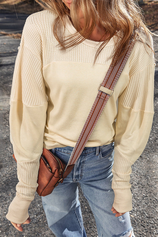 Top de manga larga de punto térmico color beige con retales y costuras expuestas
