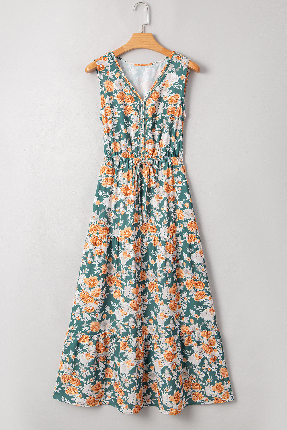 Vestido largo de fiesta sin mangas con cuello de pico, ajuste en la cintura con lazo y estampado floral verde