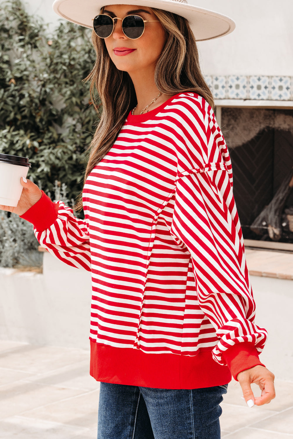 Top tipo jersey casual de hombros caídos con costuras expuestas a rayas naranjas