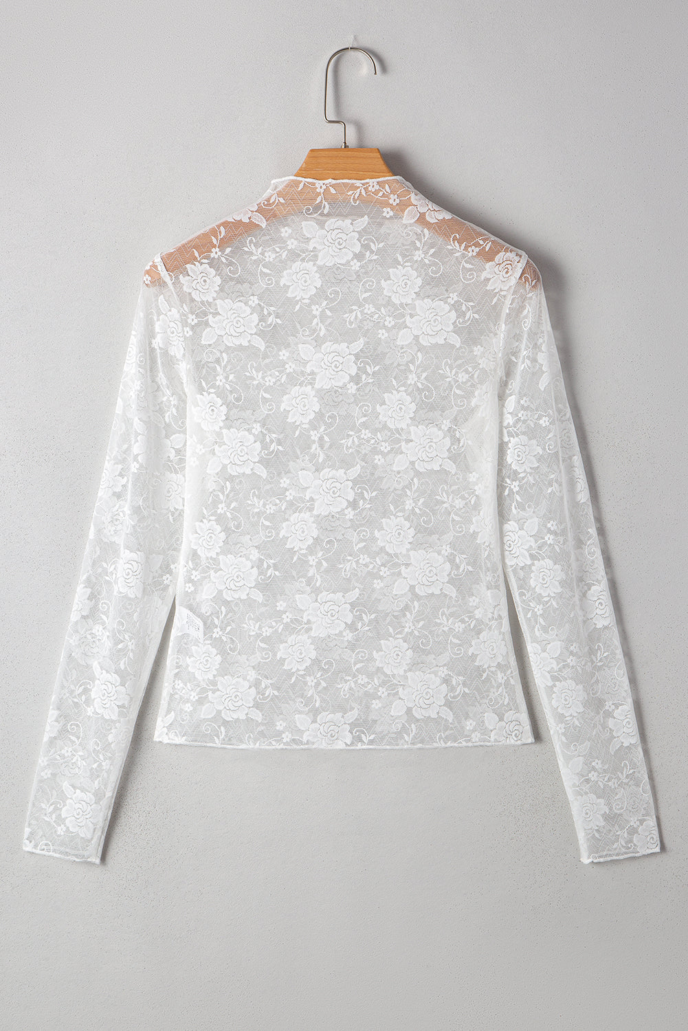 Top de manga larga de malla de encaje floral con cuello simulado en rosa albaricoque