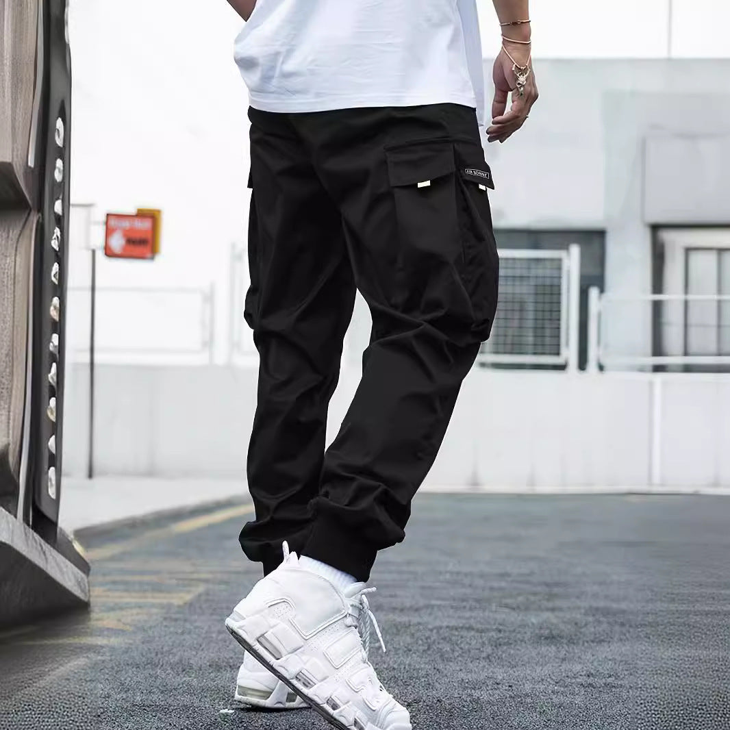 Pantalones cargo de hombre con múltiples bolsillos y cordón