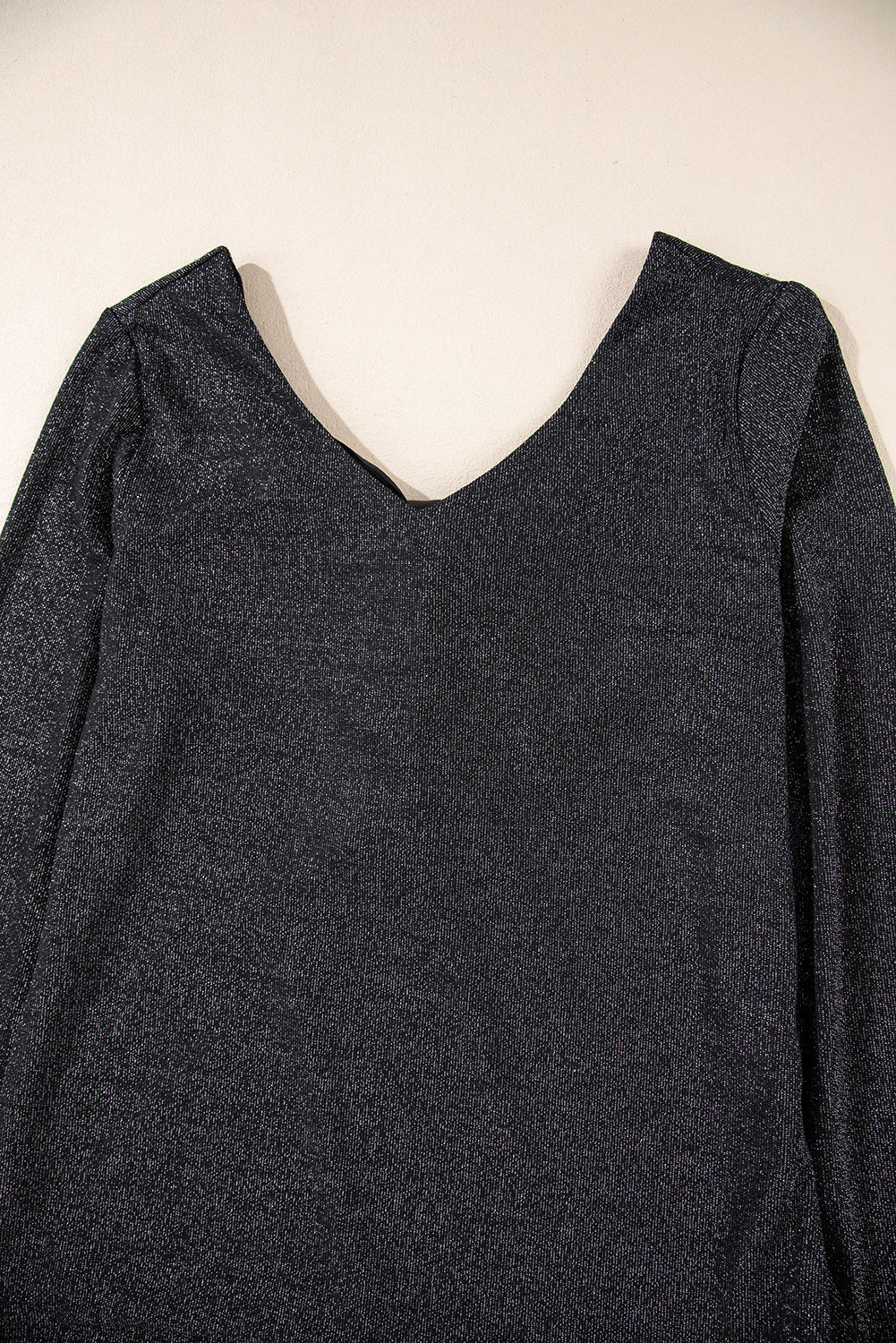 Blusa de manga larga con lazo y cuello en V