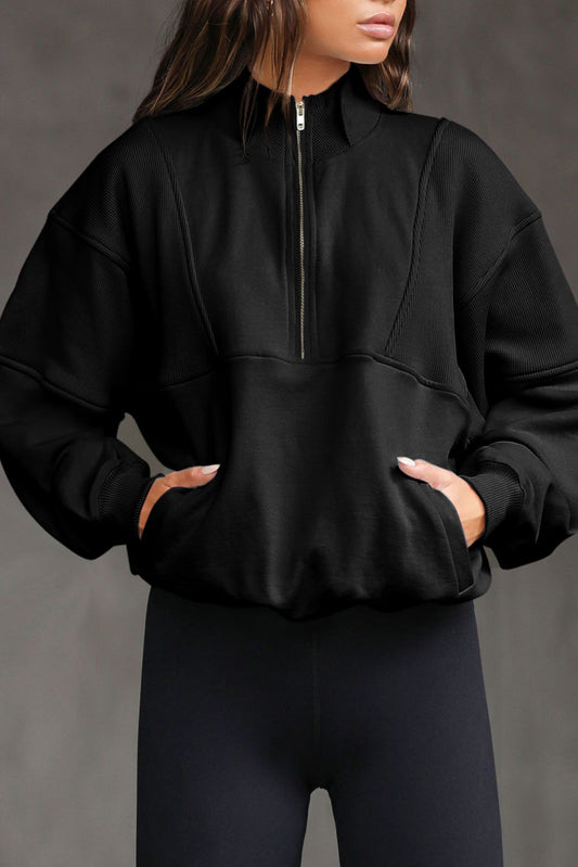Sudadera informal de color liso, media cremallera, cuello alto y costuras expuestas - Negra