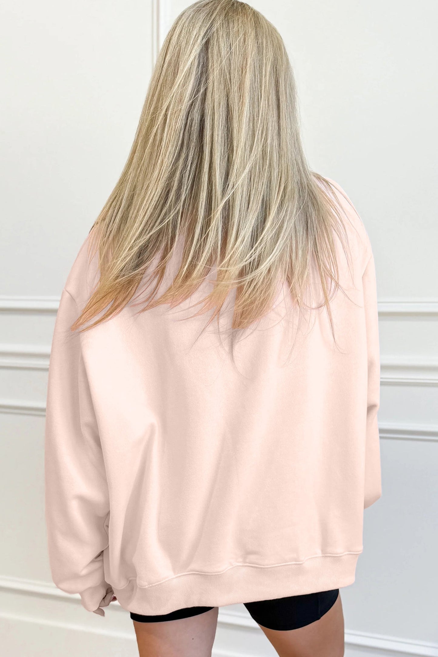 Sudadera holgada de cuello alto color albaricoque con letras de TEXAS estampadas