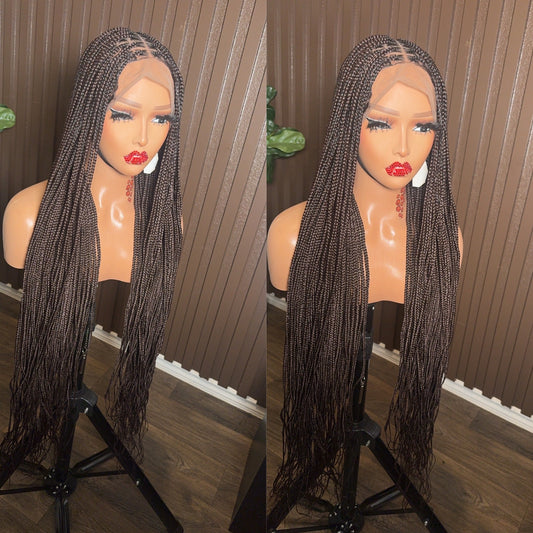 Trenzas sueltas (knotless) marrones de nudos medianos