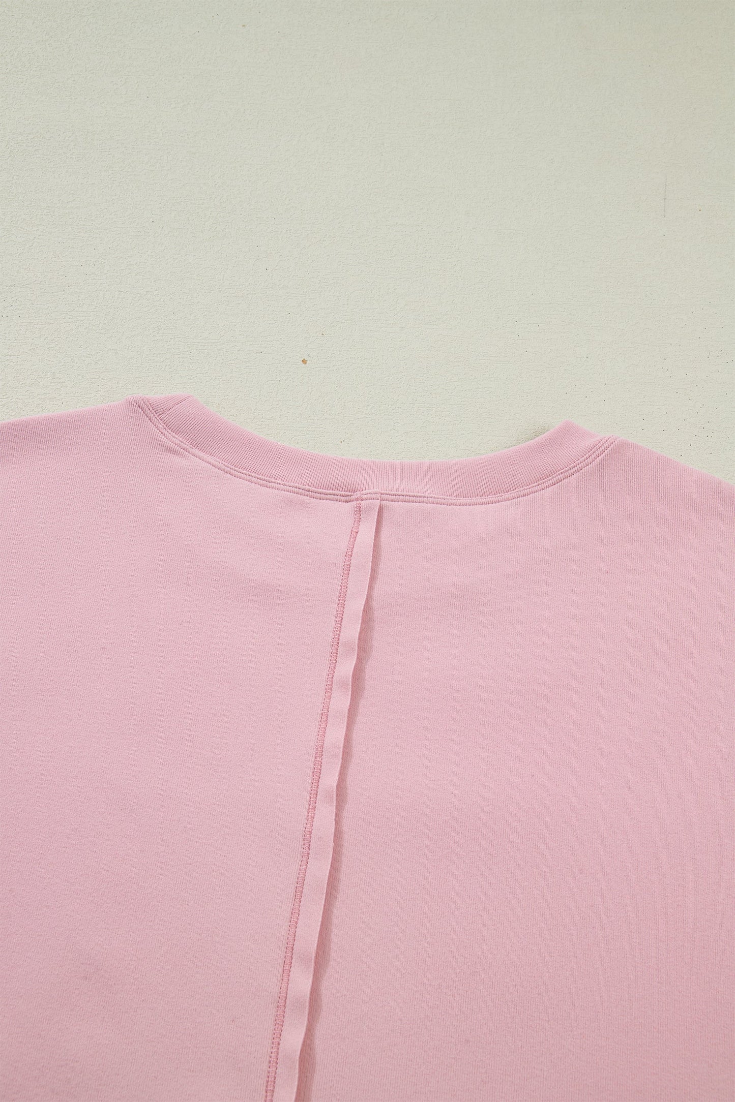 Camiseta de manga larga con retazos texturizados y lazo, color rosa claro liso