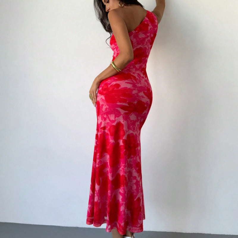 Vestido de mujer estilo europeo y americano con estampado de patrón irregular, tirantes y hombros.