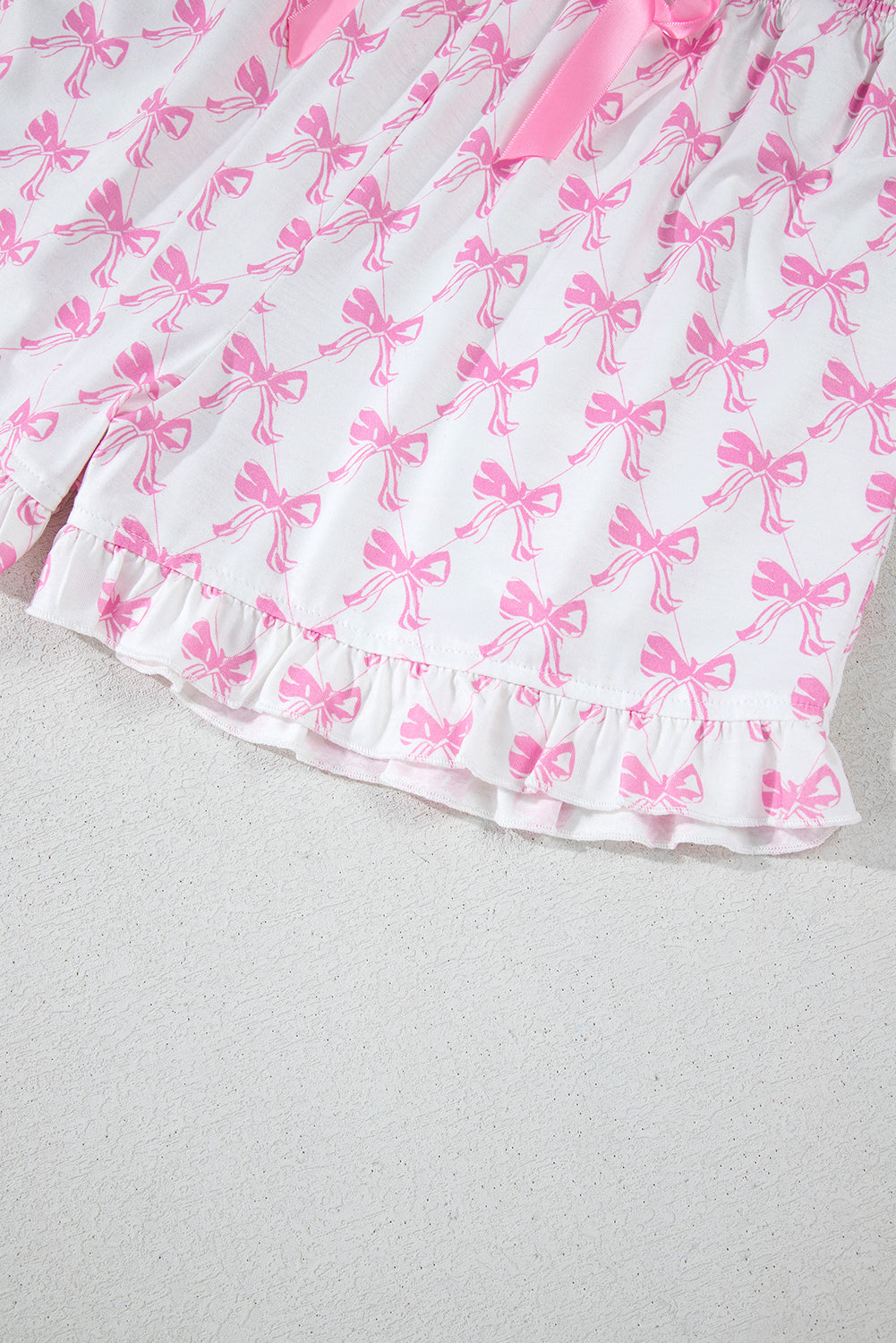 Conjunto de pijama de camisa con estampado de lazo rosa y shorts con dobladillo con volantes