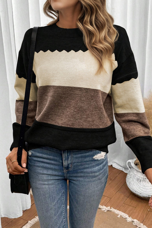 Suéter cuello redondo negro con bloques de color y hombros caídos