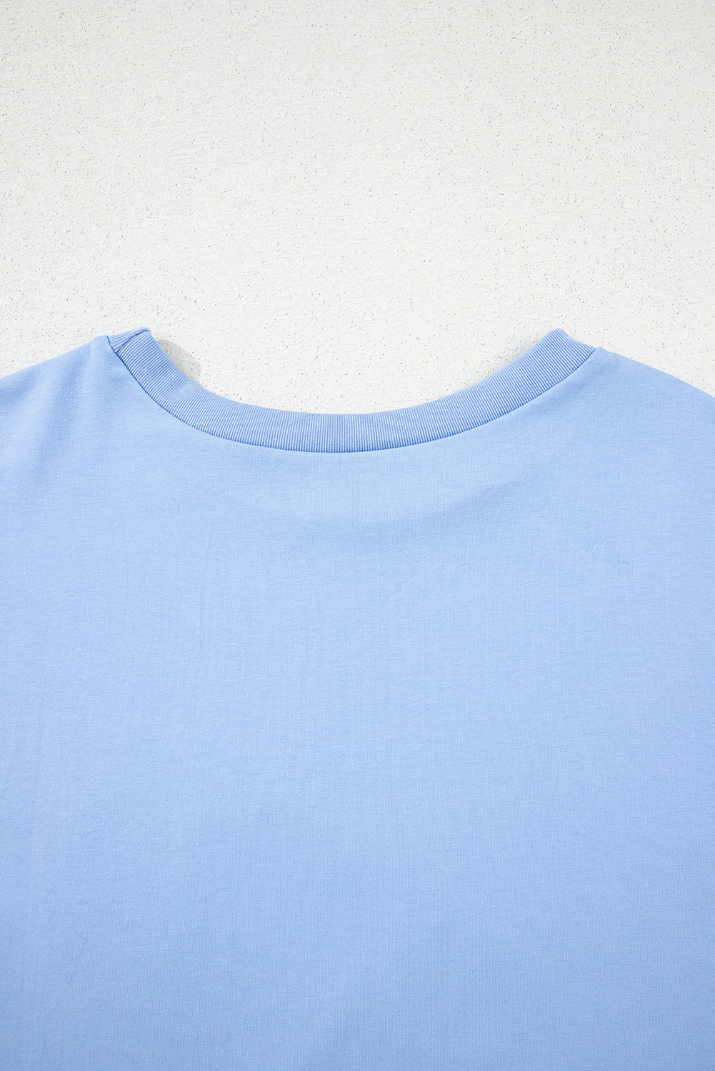 Camiseta de manga media suelta con bajo asimétrico Myosotis