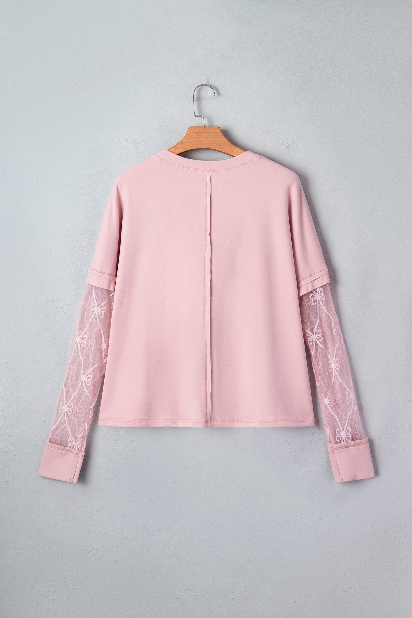 Camiseta de manga larga con retazos texturizados y lazo, color rosa claro liso