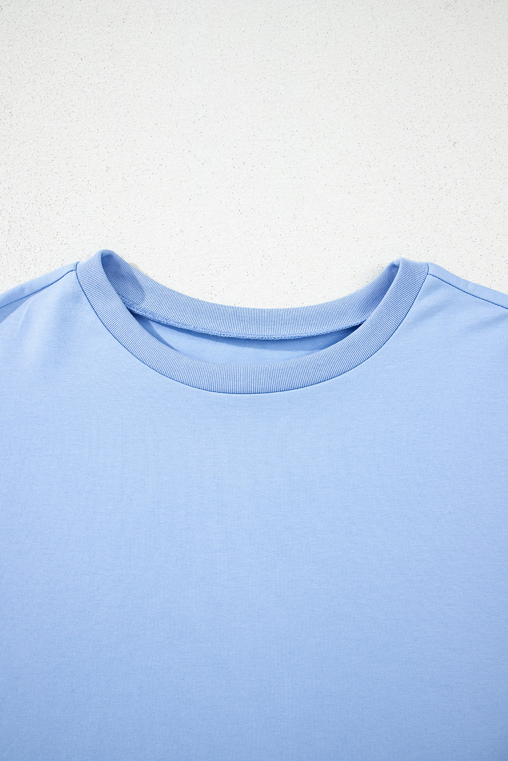 Camiseta de manga media suelta con bajo asimétrico Myosotis