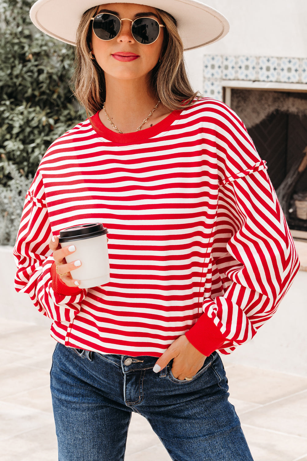 Top tipo jersey casual de hombros caídos con costuras expuestas a rayas naranjas