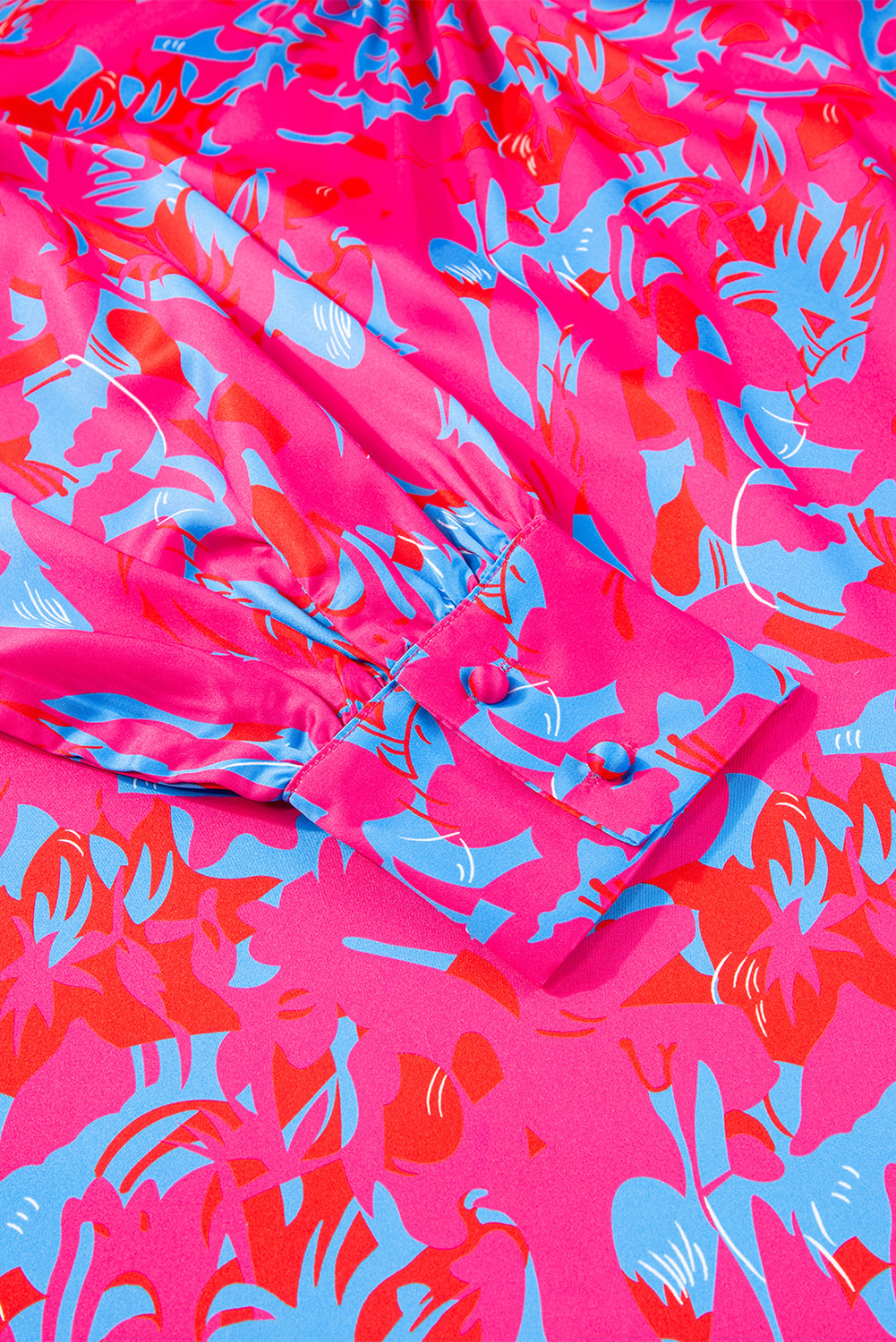 Blusa morada con estampado, mangas abullonadas y cuello alto