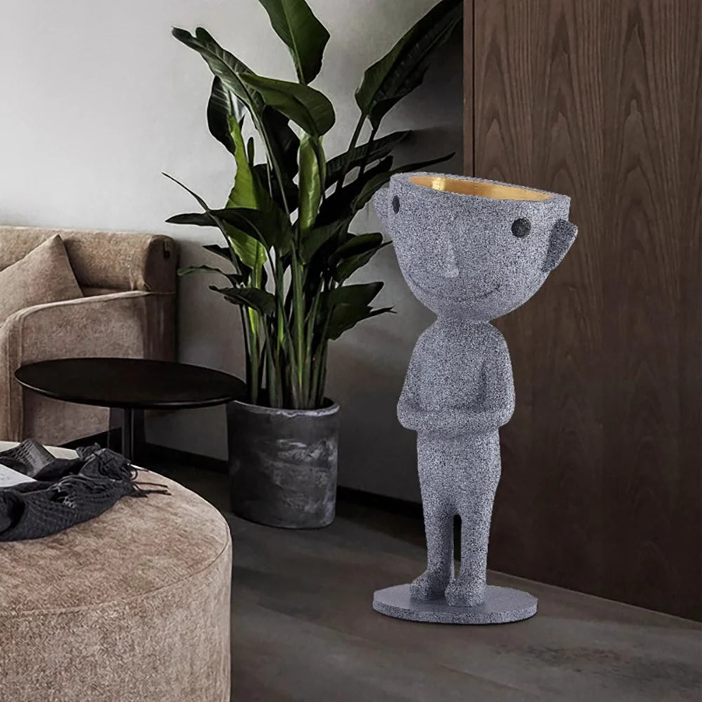 Lámpara de pie con estatua alienígena