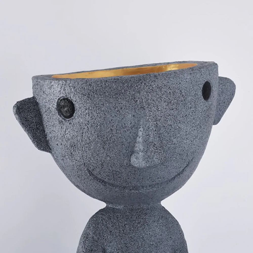 Lámpara de pie con estatua alienígena