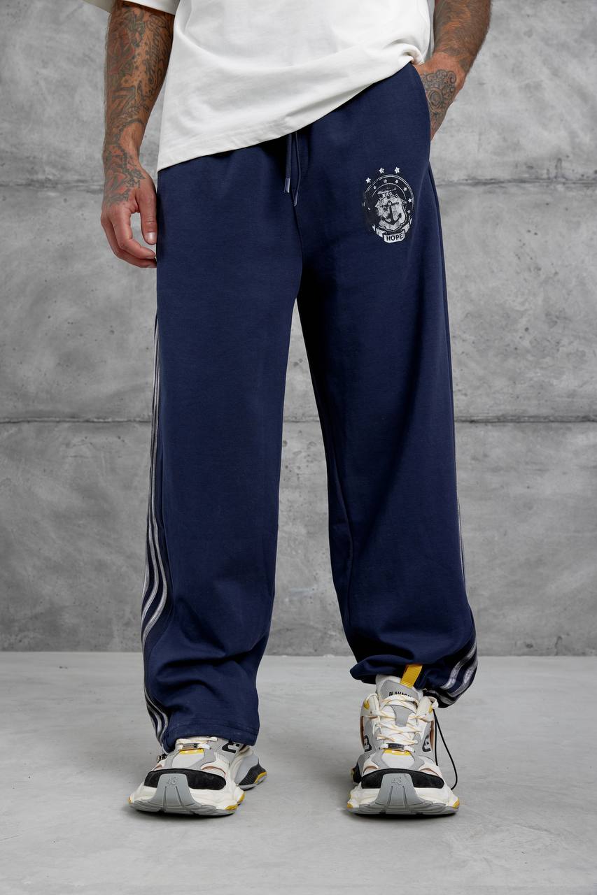 Pantalones deportivos holgados con raya lateral