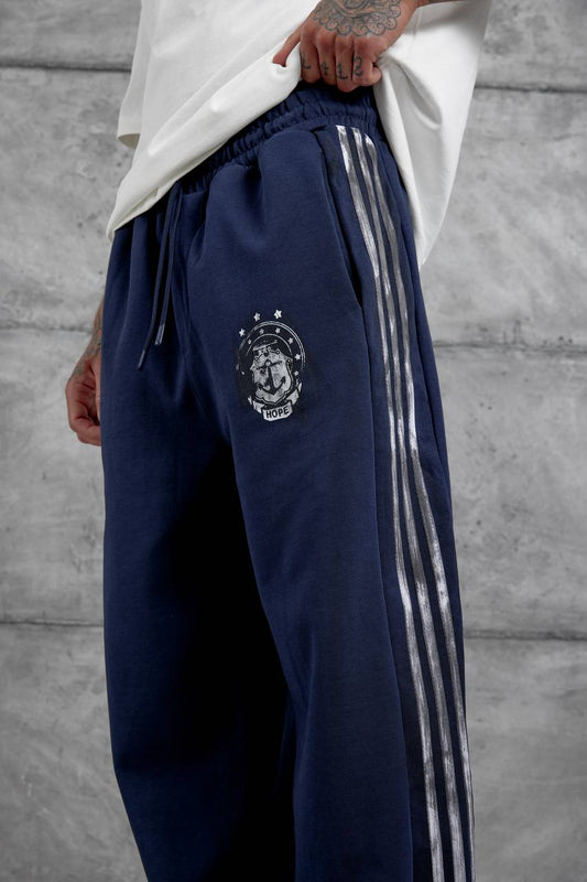 Pantalones deportivos holgados con raya lateral