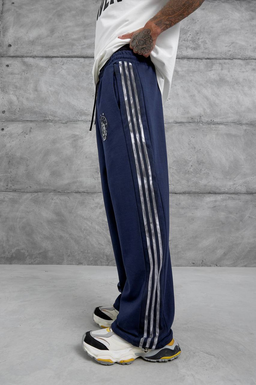 Pantalones deportivos holgados con raya lateral