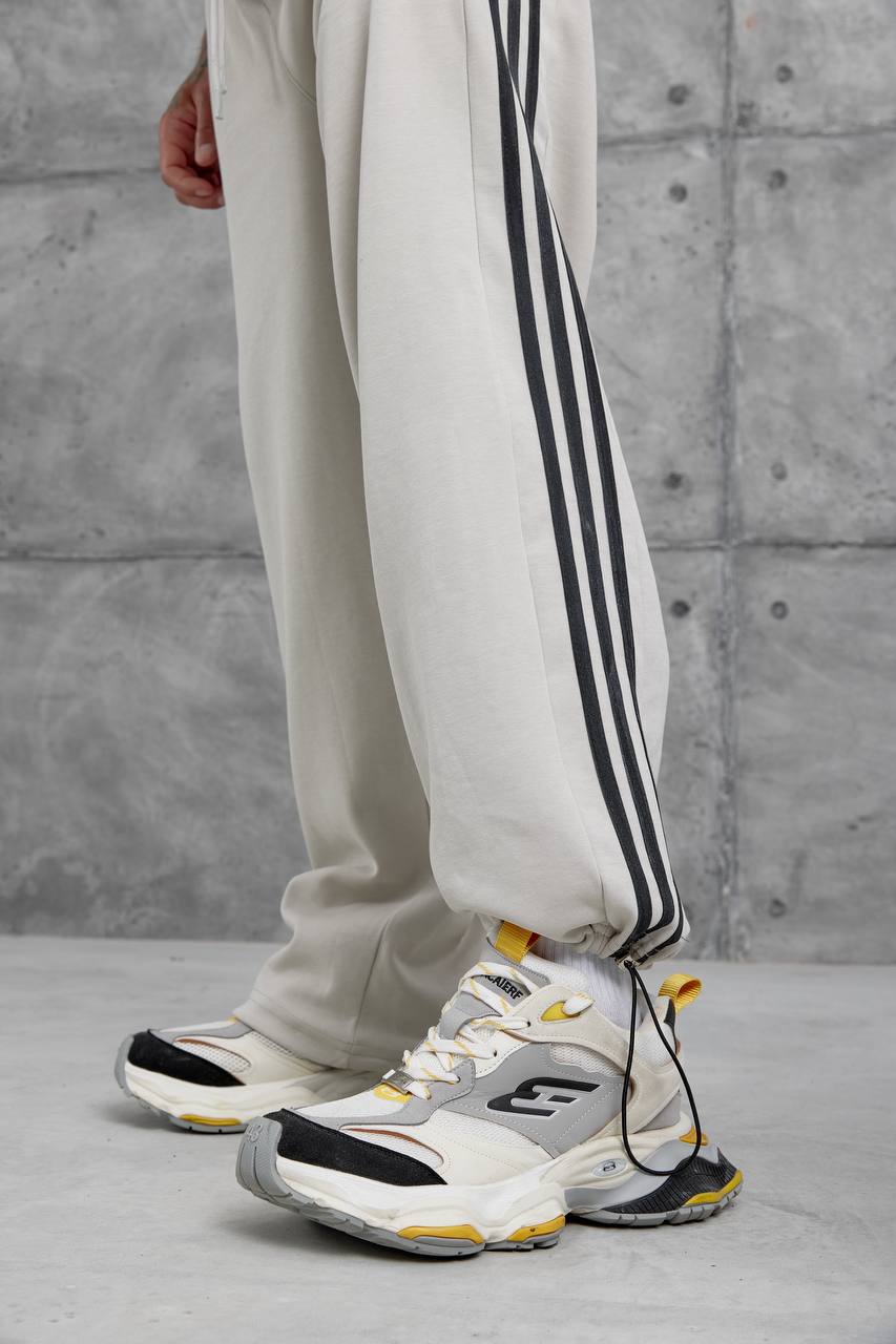 Pantalones deportivos holgados con raya lateral
