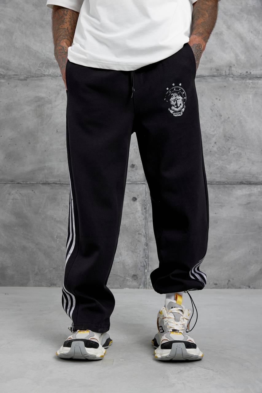 Pantalones deportivos holgados con raya lateral