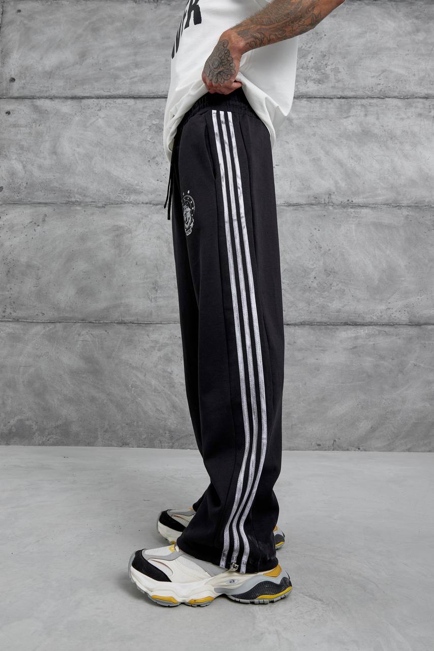 Pantalones deportivos holgados con raya lateral