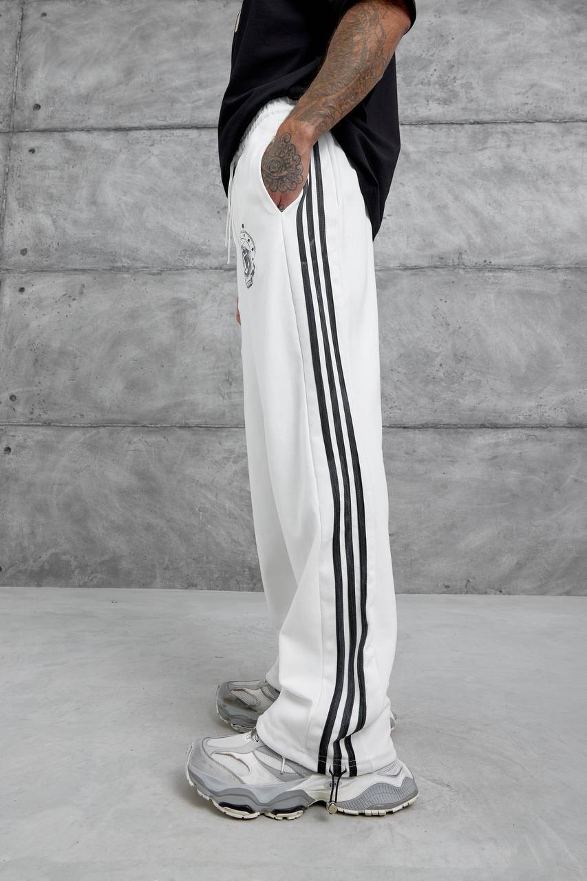 Pantalones deportivos holgados con raya lateral