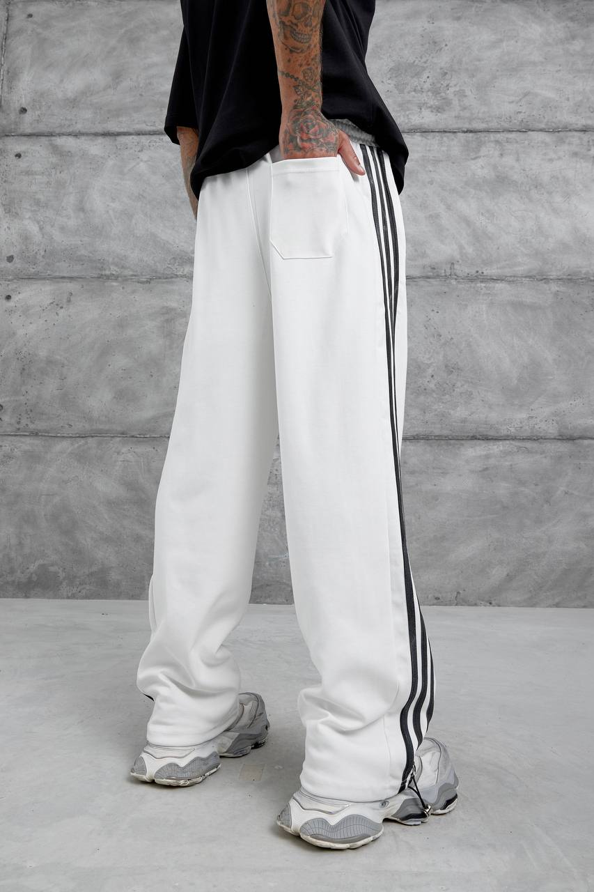 Pantalones deportivos holgados con raya lateral