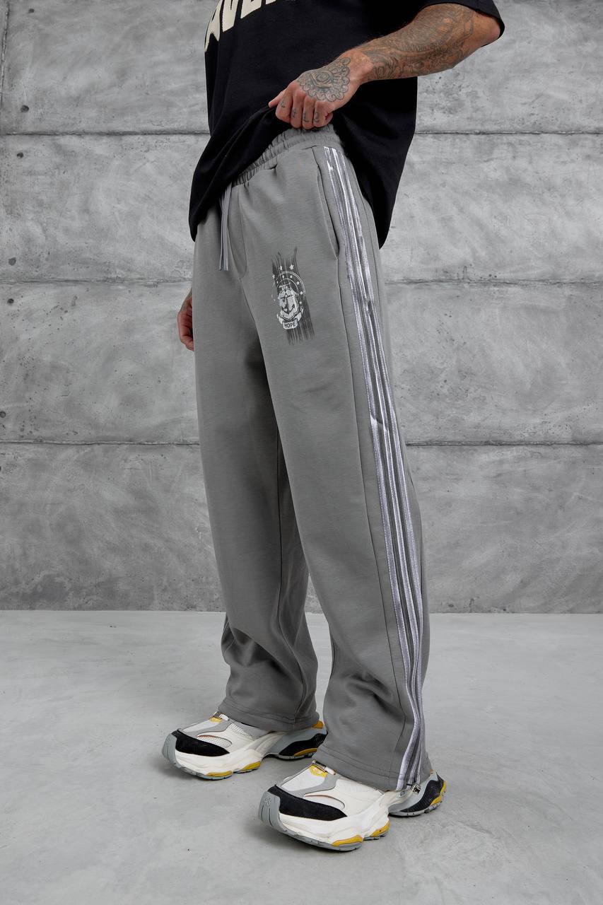 Pantalones deportivos holgados con raya lateral