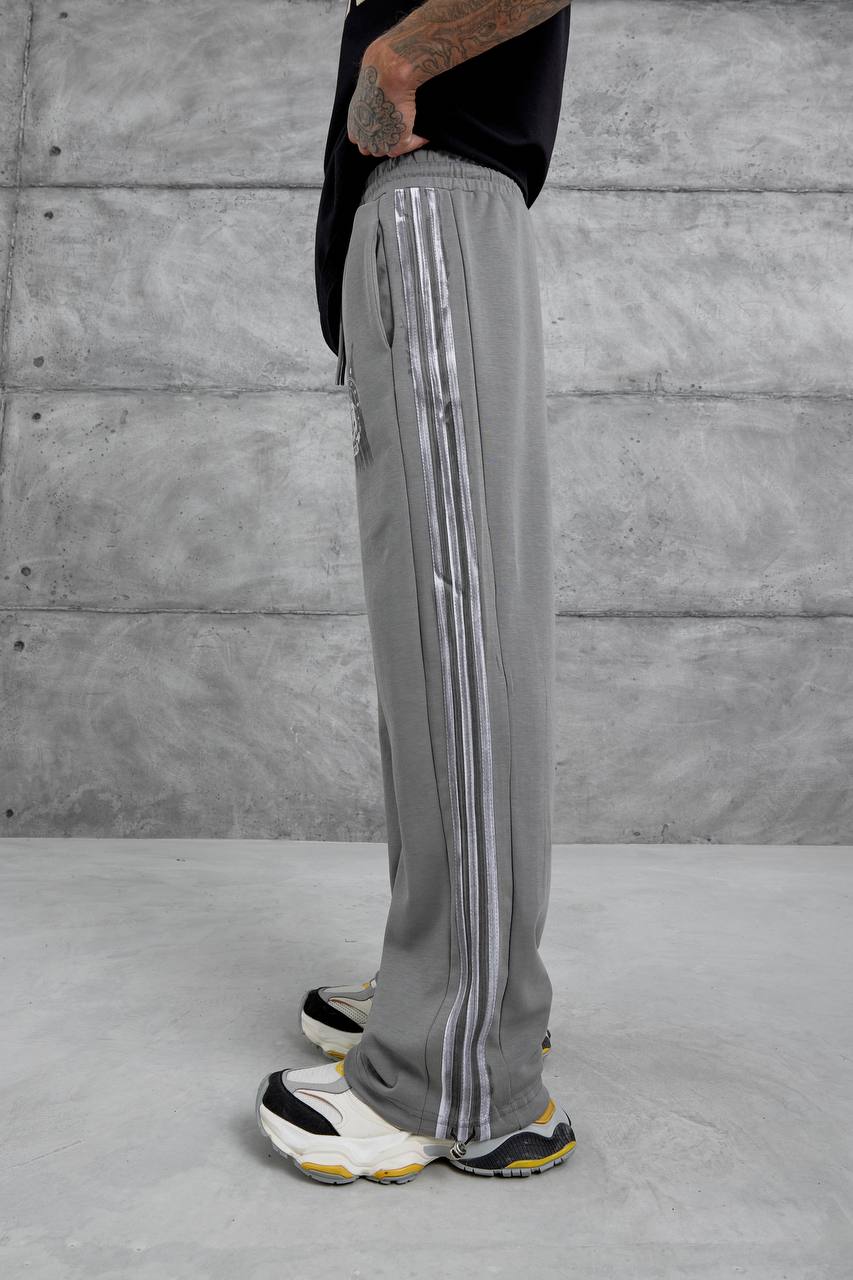 Pantalones deportivos holgados con raya lateral