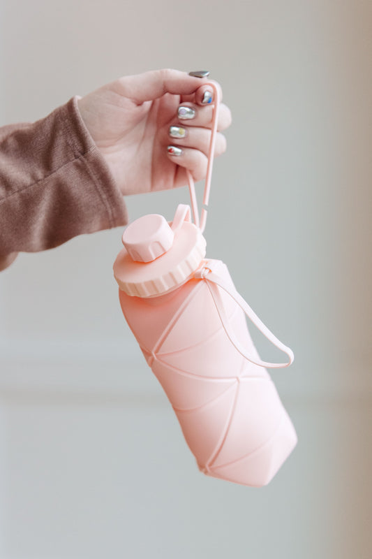 Botella de agua de silicona plegable en rosa diamante