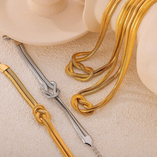 Acaban de llegar las camisetas Trendsi - Elegante pulsera de nudo bañada en oro