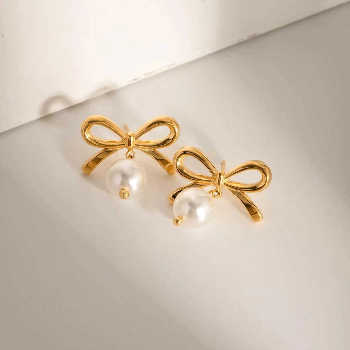Pendientes de lazo de perlas de Trendsi - Estilo elegante y delicado para mujer