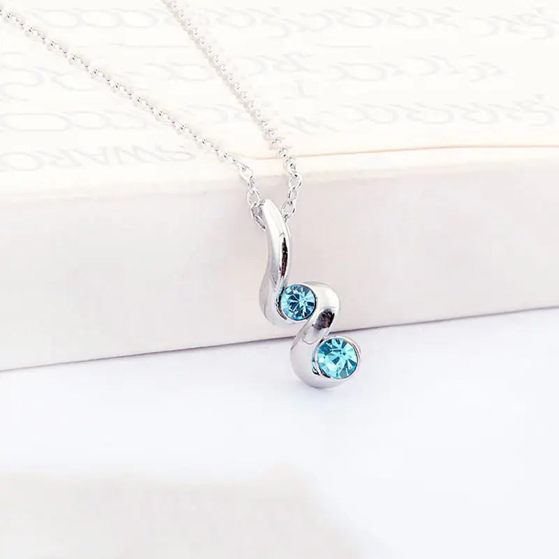 Juego de pendientes ovalados y collar con forma de serpiente y cristales
